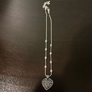 Brighton reversible heart necklace. Silver tone. Heart shaped box included.